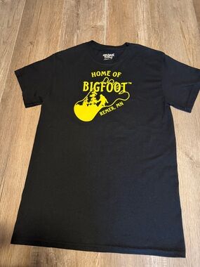 Gildan Black Tee with Yellow "Home of Bigfoot" Remer MN Graphic